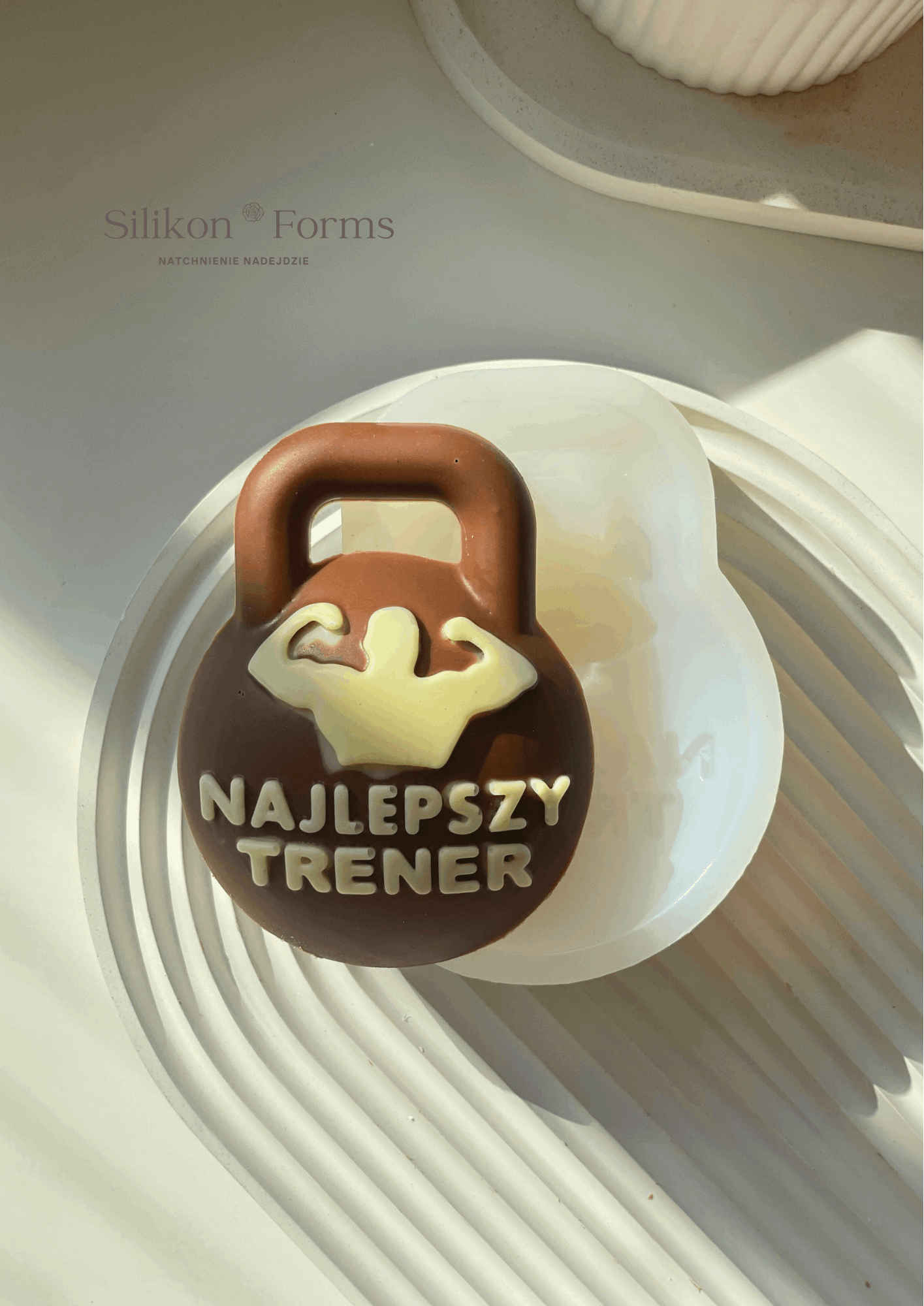 Napis "NAJLEPSZY TRENER"